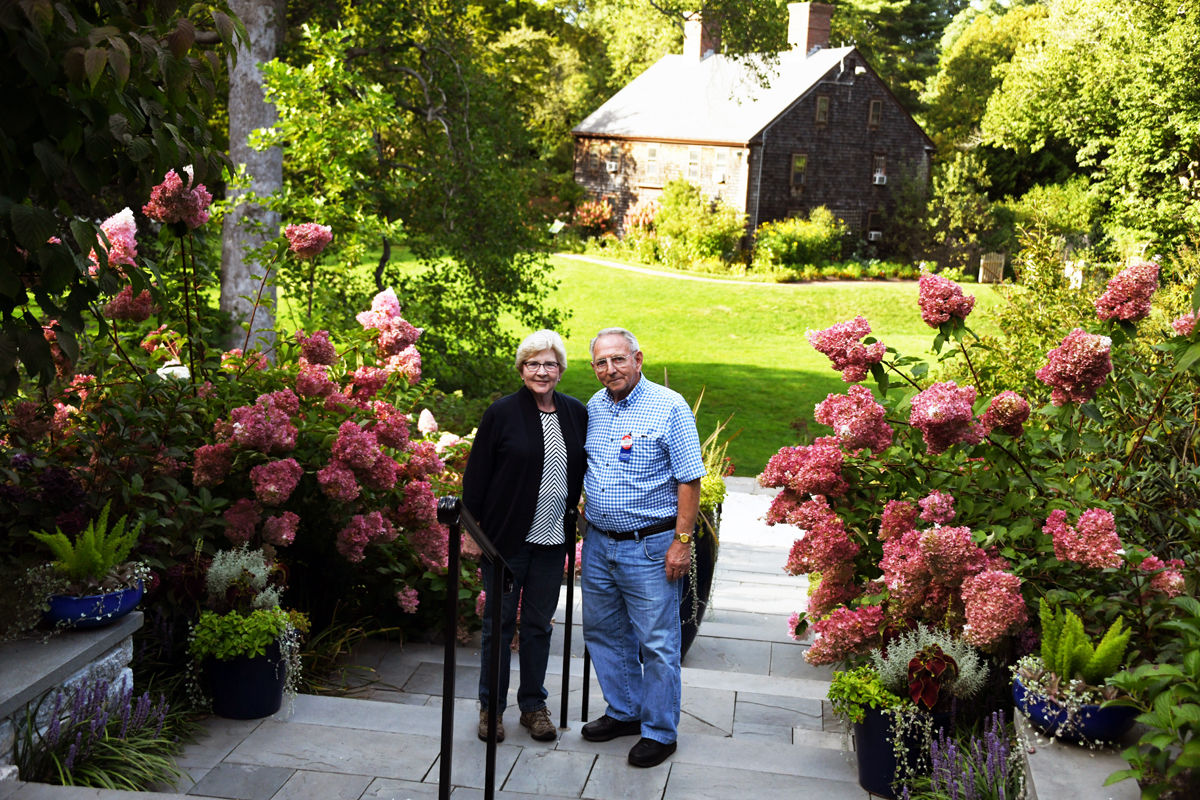 067 Carolyn and Clarence Hoffman pose among the hydrangeas at Heritage Gardens.jpg